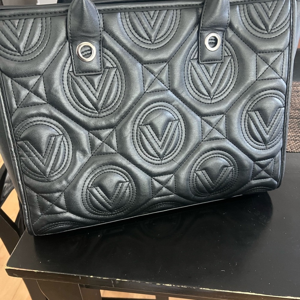 Black Quilted Tote Bag with divided compartments and makeup pouch.